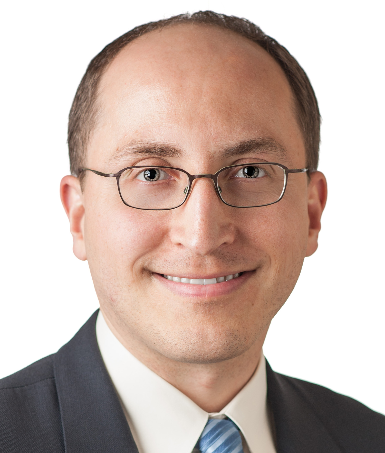 headshot of man in glasses and a dark suit