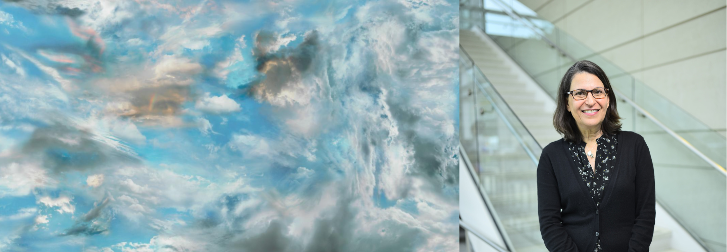 Swirling white, pink, and gray clouds against a sky blue background