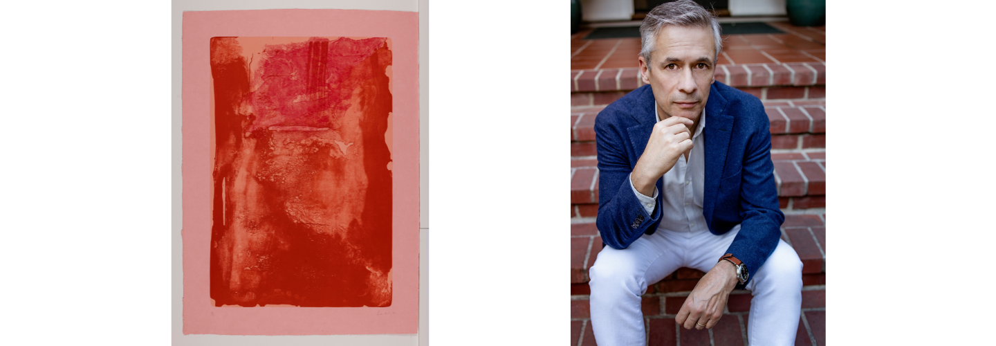 photograph of a white man in a suit sitting on brick steps