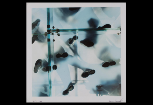 upward view of people standing on semi-translucent glass floor