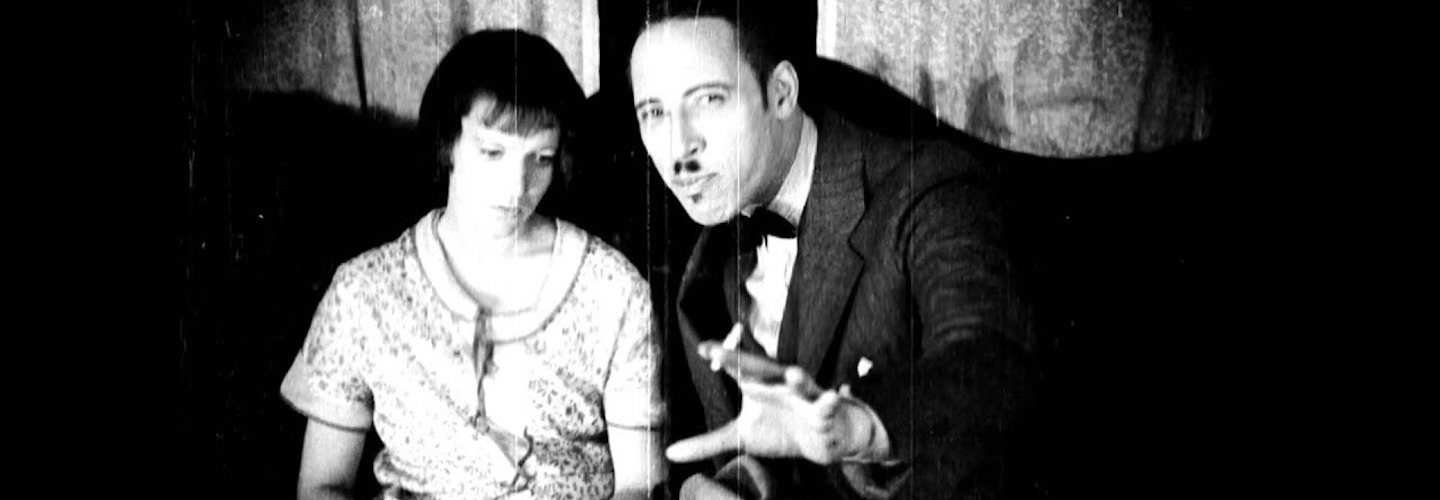 An ominous figure holding a cigarette sits next to a young woman.