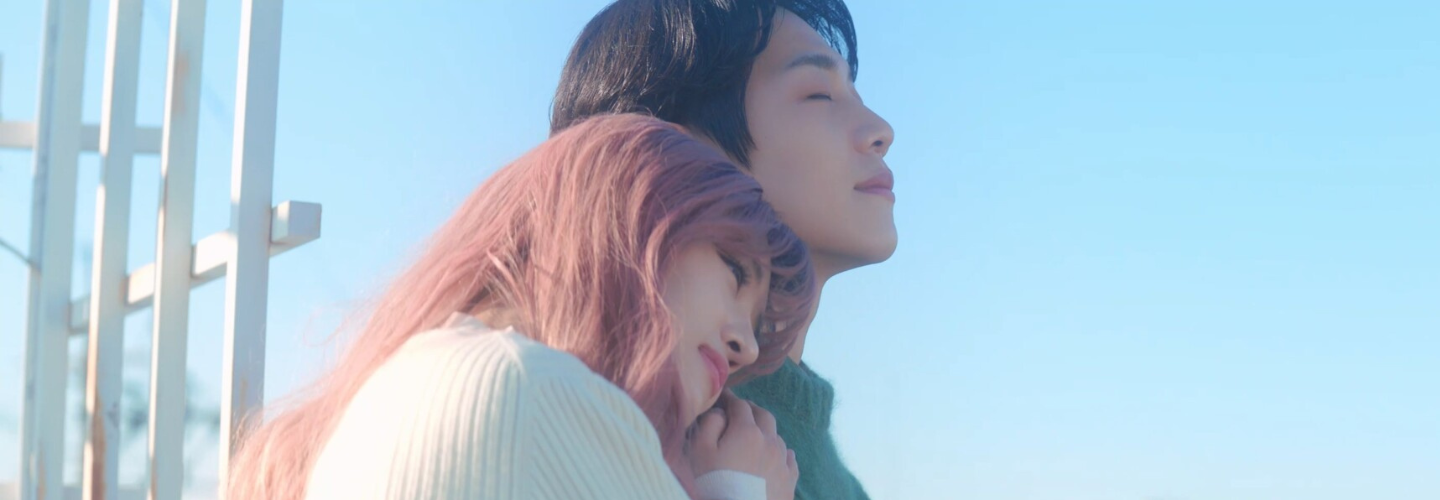 A young couple with a blue sky background