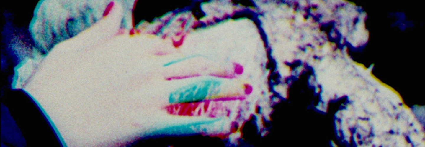 Color separation of a hand reaching out to touch a plant