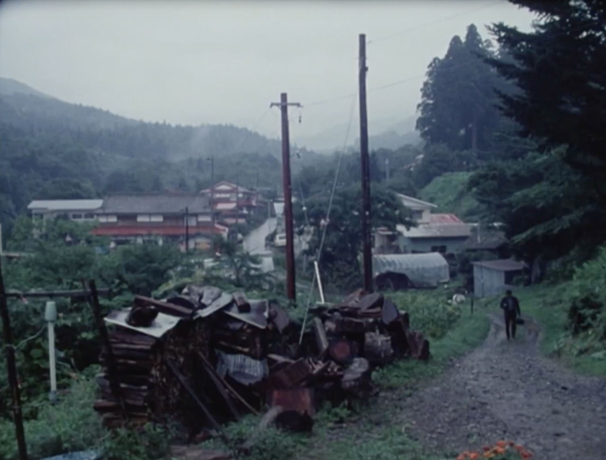 A landscape of a valley with industrial machines in the foreground