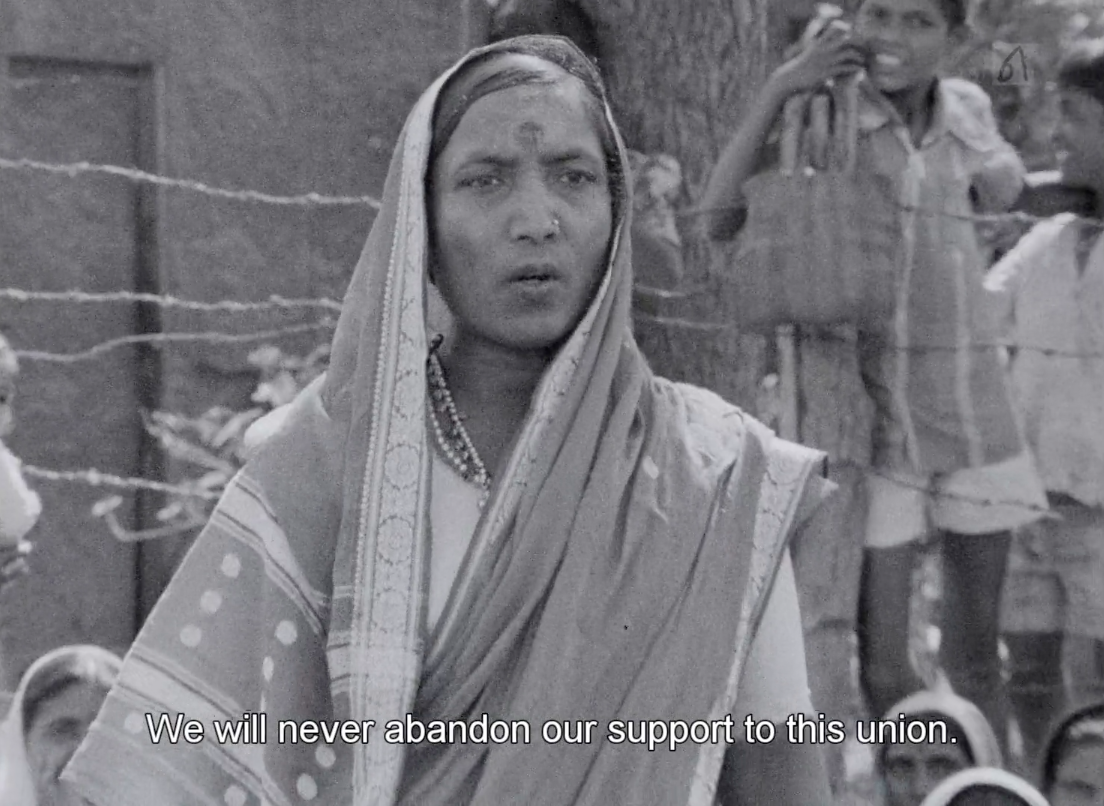 B&W image of woman speaking while organizing union