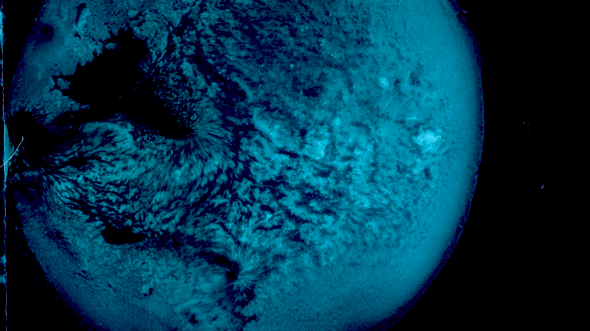 Abstract blue orb with a black background