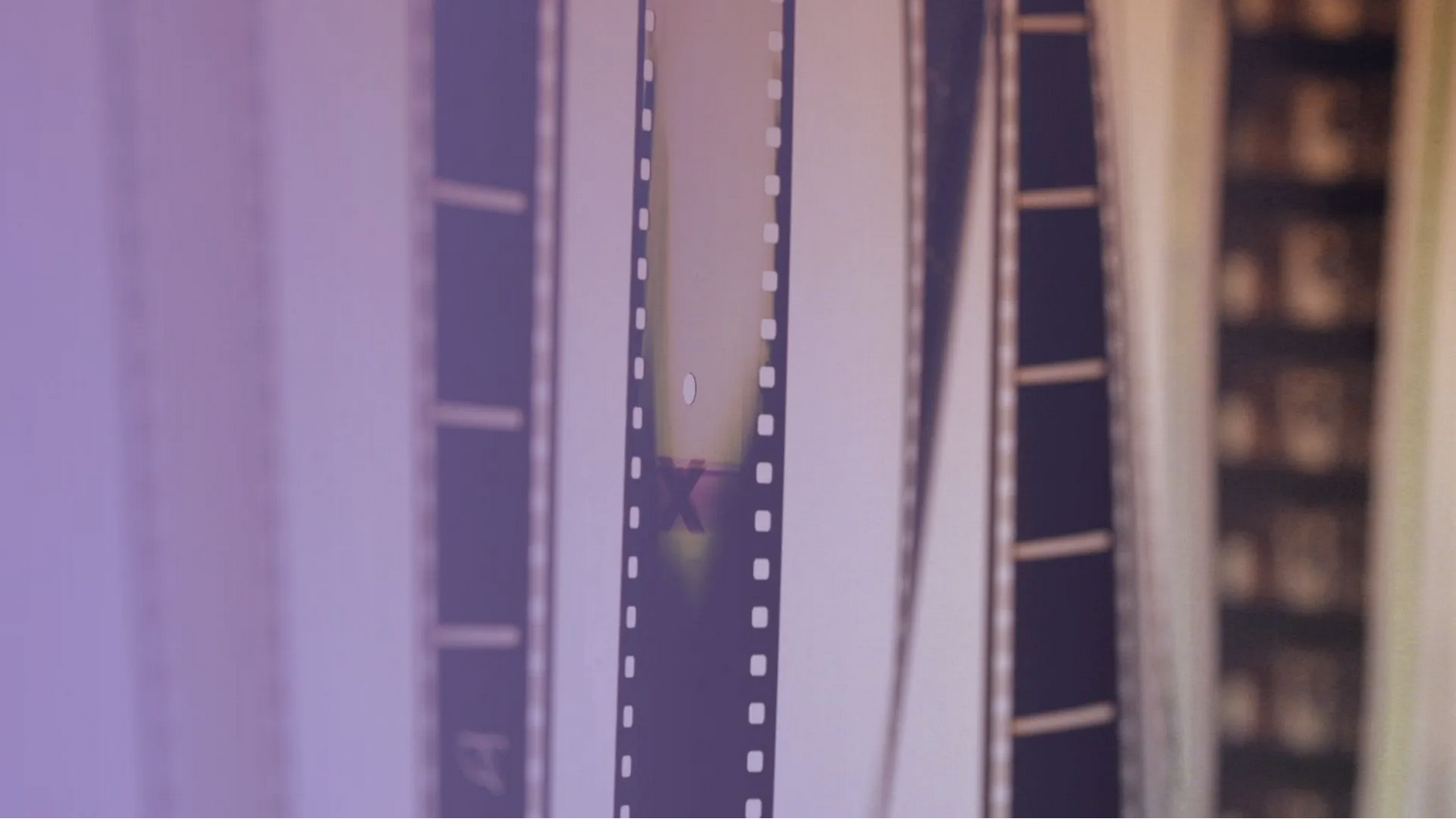 Image of film strips with light purple overlay